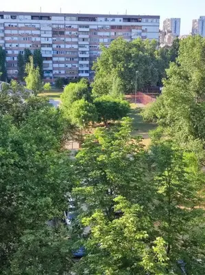 an overhead view of a park with trees and buildings at Magenta New Belgrade in Belgrade