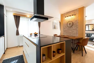 a kitchen with a counter and a kitchen island at 1-Bedroom Apartment with Balcony in Ledine