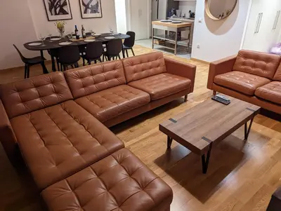 a living room with a couch and a table at Luxury Belgrade Waterfront top floor Apt with an amazing view in Belgrade