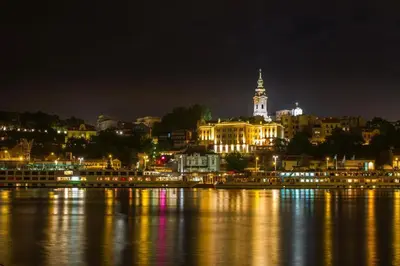 a city lit up at night on the water at Belgrade River view 1 in Belgrade