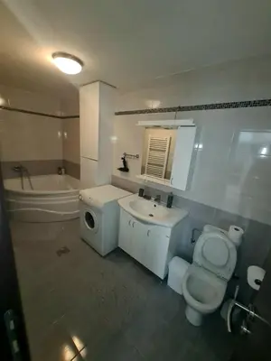 a bathroom with a toilet and a sink and a tub at Fantastic Belgrade Nights in Belgrade
