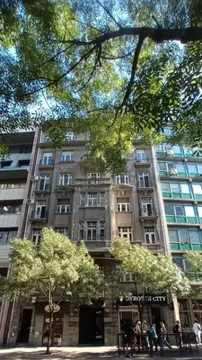 a large building with people standing in front of it at Authentic Belgrade Centre Apartments for large groups, Republic Square - Up to 47 People in 5 Apartments in Belgrade