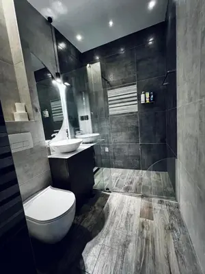 a bathroom with a toilet and a sink at New Grey in Novi Beograd