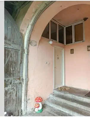 an entrance to a building with a door and a stuffed animal at Maravilja 23 in Filmski Grad