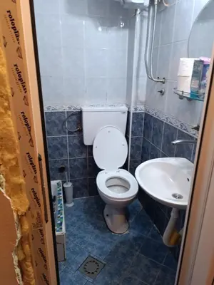 a small bathroom with a toilet and a sink at Maravilja 23 in Filmski Grad