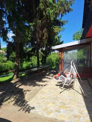 a couple of chairs sitting on a patio at Kuća za odmor Sara in Čortanovci