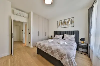a bedroom with a large bed in a room at Modern apartment on the Belgrade Waterfront in Belgrade