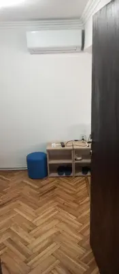 an office with a desk and a blue chair at Airpot MD rooms 1 in Belgrade