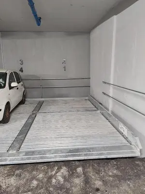 a parking garage with a car parked in it at Apartment Stevanovic Belgrade in Vračar (historical)