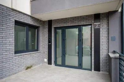 a glass door on the side of a building at TOP VIEW apartment 46 in Arandjelovac