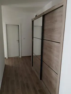 a room with a sliding door with mirrors at Amare in Inđija