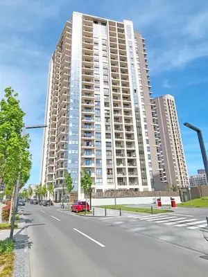 a large building on the side of a street at Premium Simfonija Apartment in Belgrade