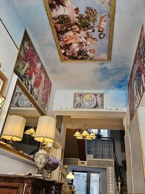 a room with paintings on the ceilings of a room at VANSVEL Boutique Apartment 14 in Belgrade