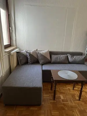 a living room with a couch and a table at Apartment Crystal in Belgrade