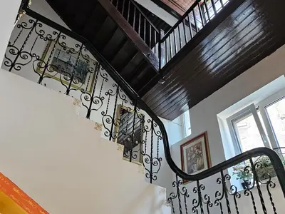 a staircase with wrought iron railings in a house at Belgrade Luxury Suite 19 in Belgrade