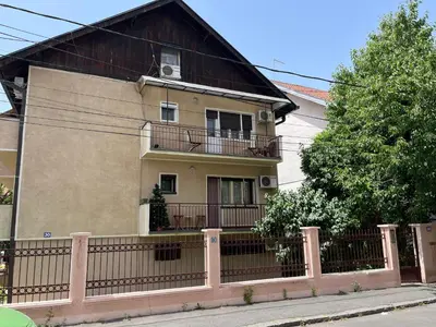 a house with a fence in front of it at istanbul apartment 1 in Belgrade