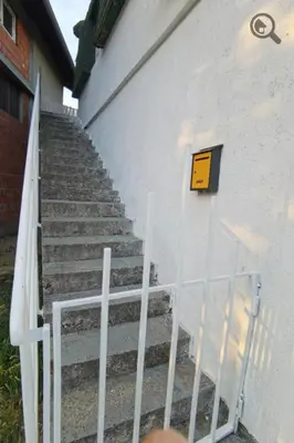 a set of stairs next to a white building at Konza1 in Belgrade