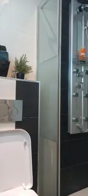 a bathroom with a toilet and a glass shower at Perfect place to stay in Belgrade