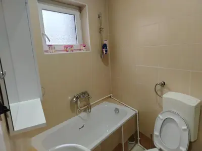 a bathroom with a toilet and a sink and a tub at PRAMAC - stan na dan in Belgrade