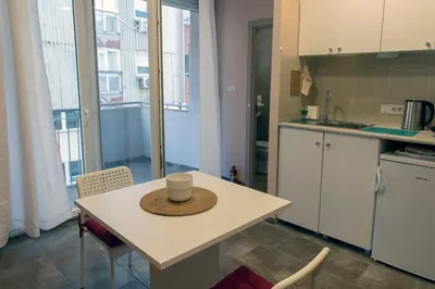 a kitchen with a table with a hat on it at Studio Anrora 2 in Belgrade