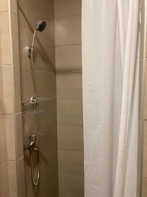a shower in a bathroom with a shower curtain at Studio Anrora 2 in Belgrade