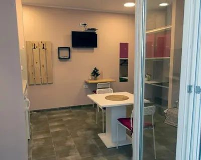 a room with a table and chairs in a room at Studio Anrora 4 in Belgrade
