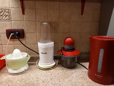 a kitchen counter with a blender and other appliances at Mirara in Belgrade