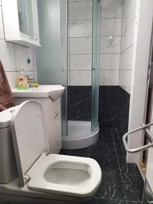 a bathroom with a toilet and a glass shower at Double Lux Aparrment A1 in Pancevo in Pančevo