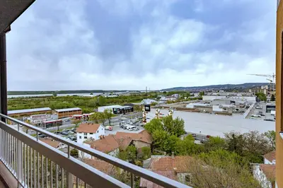 a view of a city from a balcony at PLEASURE LUX Bg in Belgrade