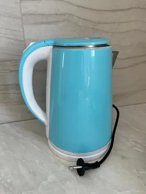 a blue and white mug sitting on the floor at Airport Art Villa in Ćosine Kolibe