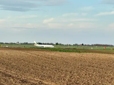an airplane is taking off from an airport runway at Belgrade Airport Beds in Surčin