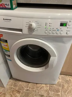a white washing machine sitting in a kitchen at Fontana in Belgrade