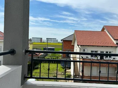 a balcony with a view of a field and buildings at Belgrade Airport luxury 2 room in Surčin