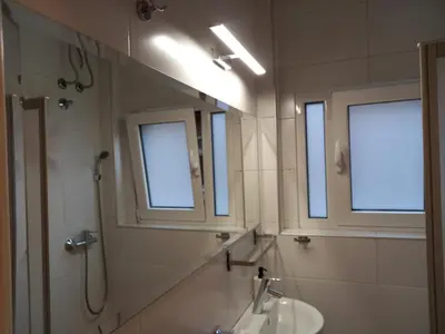 a bathroom with a sink and a mirror at Adagio 7 in Belgrade