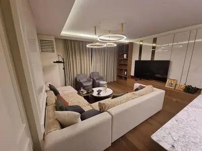 a living room with a couch and a tv at Exclusive apartman BW Terraces in Belgrade