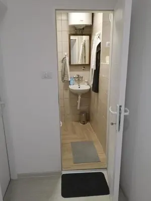 a small bathroom with a sink and a toilet at Belgrade Center Lux in Belgrade