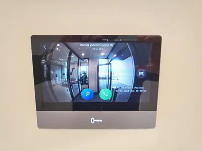 a tablet screen on a wall with a picture at Arkadija Lux Apartment River And Tower View in Belgrade