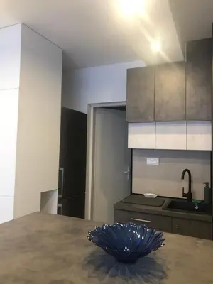 a kitchen with a blue bowl on a table at Beograd stan na dan in Novi Beograd