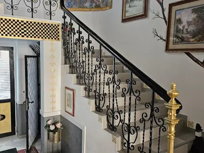 a stairway with a black and white stair railing at Belgrade Luxury Suite 23 in Belgrade