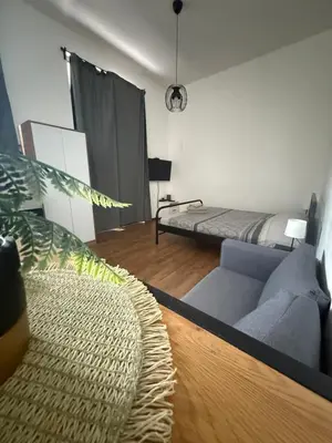a living room with a couch and a bed at Amar3 in Belgrade
