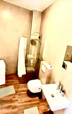 a bathroom with a toilet and a sink and a shower at Amar 2 in Belgrade