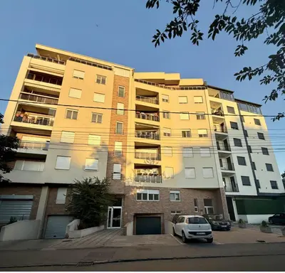 a building with a car parked in front of it at Amar 1 in Belgrade