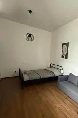 a room with a bed and a couch in it at Amar 3 in Belgrade