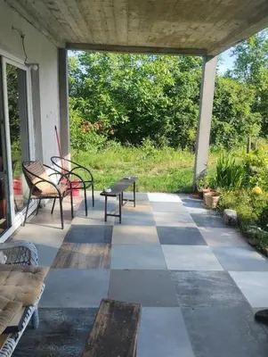 a porch with two benches and a table at Sunny Villa in Belgrade
