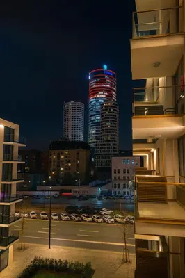 a night view of a city with tall buildings at Belgrade Waterfront LuX Sky Residence in Belgrade