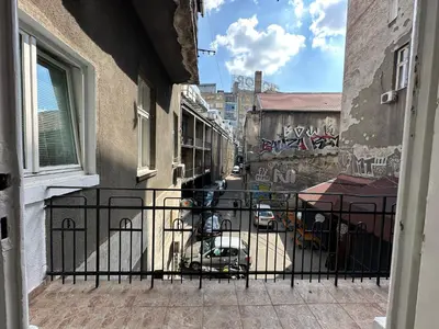 a view from a balcony of a street with graffiti at Eight Apartment Two Bedroom City Centre Comfort in Belgrade
