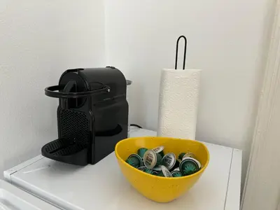 a bowl of money sitting on top of a counter at Eight Apartment Two Bedroom City Centre Comfort in Belgrade