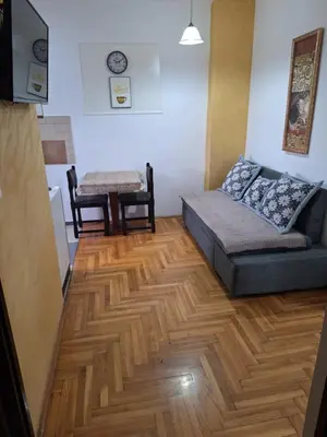 a living room with a couch and a table at Rooms1 in Beograd