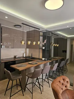 a kitchen with a large table and chairs at Miss Extra LuX in Mladenovac