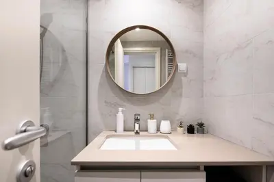 a bathroom with a sink and a mirror at inJoy in Belgrade